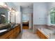 Bathroom featuring a separate tub and dual sink vanity at 17 Shotgun Nw Rd, Cartersville, GA 30121