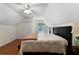 Bright bedroom features a ceiling fan, hardwood floors, and a window for natural light at 17 Shotgun Nw Rd, Cartersville, GA 30121