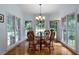 Charming breakfast nook with large windows offering natural light and views of the surrounding trees at 17 Shotgun Nw Rd, Cartersville, GA 30121