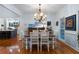 Elegant dining room with hardwood floors, a decorative chandelier, and modern furnishings at 17 Shotgun Nw Rd, Cartersville, GA 30121