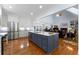 Open-concept kitchen with stainless appliances, large island, and views of the living area and fireplace at 17 Shotgun Nw Rd, Cartersville, GA 30121