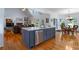 Well-appointed kitchen with island seating, stainless dishwasher, and open flow to the dining and living spaces at 17 Shotgun Nw Rd, Cartersville, GA 30121