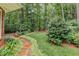Lush garden featuring a stone walkway, colorful flowers, and mature trees, creating a serene backyard space at 17 Shotgun Nw Rd, Cartersville, GA 30121