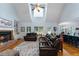 Spacious living room with vaulted ceilings, a cozy fireplace, and open access to the kitchen at 17 Shotgun Nw Rd, Cartersville, GA 30121