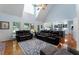 Bright, open living room boasts vaulted ceilings, large windows, and access to an eat-in kitchen for easy entertaining at 17 Shotgun Nw Rd, Cartersville, GA 30121