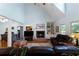 Inviting living room featuring hardwood floors, a brick fireplace, and built-in bookshelves at 17 Shotgun Nw Rd, Cartersville, GA 30121