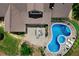 Aerial view of a backyard featuring a freeform pool with integrated spa, patio with dining, and lush landscaping at 17 Shotgun Nw Rd, Cartersville, GA 30121