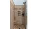 Walk-in shower with decorative tile and built-in shelving at 17 Shotgun Nw Rd, Cartersville, GA 30121