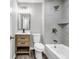 Well-lit bathroom featuring a modern vanity and sleek, tiled shower with glass door at 2089 Christian Se Cir, Conyers, GA 30013