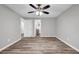 This bedroom features a ceiling fan, luxury vinyl flooring and a closet at 2089 Christian Se Cir, Conyers, GA 30013