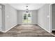 Bright dining room featuring new floors, and a patio door leading to the backyard at 2089 Christian Se Cir, Conyers, GA 30013