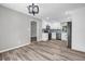 Bright kitchen features stainless steel appliances, white cabinetry and wood-look flooring at 2089 Christian Se Cir, Conyers, GA 30013