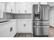 Updated kitchen showcases new stainless refrigerator and bright white cabinets and counters at 2089 Christian Se Cir, Conyers, GA 30013
