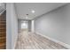 Finished basement with wood-look floors, recessed lighting, and access to stairs and other rooms at 2878 Wesley Heath Nw, Atlanta, GA 30327