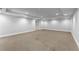 Large finished basement with neutral carpet, recessed lights, and ample open space at 2878 Wesley Heath Nw, Atlanta, GA 30327