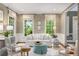 Bright living room features stylish seating, natural light, and sophisticated decor at 2878 Wesley Heath Nw, Atlanta, GA 30327