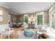 Comfortable living room with neutral tones, plush seating, and natural light from large windows at 2878 Wesley Heath Nw, Atlanta, GA 30327