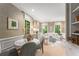 Inviting living space with a mix of seating options, natural light, and charming decor elements at 2878 Wesley Heath Nw, Atlanta, GA 30327