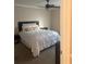 Comfortable bedroom featuring ceiling fan and large bed at 3120 Seven Pines Court # 203, Atlanta, GA 30339