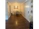 Cozy dining area with modern light fixture and wood-style flooring at 3120 Seven Pines Court # 203, Atlanta, GA 30339