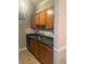 Galley kitchen with stainless steel sink and modern backsplash at 3120 Seven Pines Court # 203, Atlanta, GA 30339