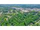 An aerial view of a neighborhood in a mature wooded area at 588 Benson Hurst Dr, Mableton, GA 30126