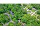 A beautiful property nestled among mature trees in a suburban neighborhood at 588 Benson Hurst Dr, Mableton, GA 30126