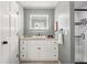 Bathroom featuring white cabinets, granite countertops, and a stylish sink and shower at 588 Benson Hurst Dr, Mableton, GA 30126