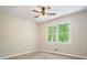 Bright bedroom with light wood floors, ceiling fan, and natural light from the window at 588 Benson Hurst Dr, Mableton, GA 30126