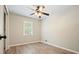 Bedroom with ceiling fan and a window, showcasing natural light and a minimalist style at 588 Benson Hurst Dr, Mableton, GA 30126