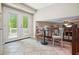 Inviting breakfast nook with natural light from the double doors with views of the wooded exterior at 588 Benson Hurst Dr, Mableton, GA 30126