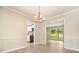 Dining room featuring hardwood floors and an open layout, creating a seamless transition to the kitchen at 588 Benson Hurst Dr, Mableton, GA 30126