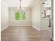 Bright dining room featuring hardwood floors and natural light, offering a welcoming space at 588 Benson Hurst Dr, Mableton, GA 30126