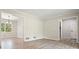 Open living room with hardwood floors and large windows providing natural light at 588 Benson Hurst Dr, Mableton, GA 30126