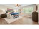 Well-lit main bedroom with hardwood floors, neutral walls, and ample natural light at 588 Benson Hurst Dr, Mableton, GA 30126