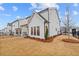 This backyard features a covered patio, and lush landscaping at 651 Summitt Hill Way, Cumming, GA 30040