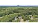 Beautiful aerial view of the house surrounded by trees in a quiet neighborhood at 7235 Compton Cir, Cumming, GA 30040