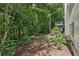 Sprawling backyard with mature trees, lush greenery, and a serene setting at 7235 Compton Cir, Cumming, GA 30040