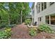 Landscaped backyard with seating area features a lush garden and beautiful plants at 7235 Compton Cir, Cumming, GA 30040