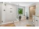 This luxurious bathroom features a walk-in shower and soaking tub next to a large window at 7235 Compton Cir, Cumming, GA 30040