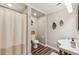Cozy bathroom with a shower, decorative pieces, neutral colors, and a unique sink at 7235 Compton Cir, Cumming, GA 30040