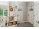 Mudroom style entry with a hall tree and hooks, a bench with underneath storage and hooks for coats at 7235 Compton Cir, Cumming, GA 30040
