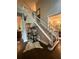 Elegant foyer featuring hardwood floors, staircase, and stylish decor at 7235 Compton Cir, Cumming, GA 30040