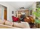 A relaxing living room with neutral walls, plants, a ceiling fan, and an outside view at 7235 Compton Cir, Cumming, GA 30040