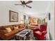 Warm living room boasting comfortable seating, an area rug, and a ceiling fan at 7235 Compton Cir, Cumming, GA 30040
