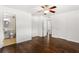 Bedroom featuring ceiling fan, hardwood floors with ensuite bathroom access at 115 Biscayne Nw Dr # F1, Atlanta, GA 30309