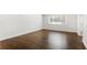 Bright bedroom showcasing hardwood floors, complemented by a window that fills the space with natural light at 115 Biscayne Nw Dr # F1, Atlanta, GA 30309