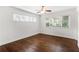 Bedroom featuring hardwood floors, ample natural light, and ceiling fan at 115 Biscayne Nw Dr # F1, Atlanta, GA 30309