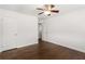 Clean bedroom featuring hardwood floors, ceiling fan, and two closets, creating a comfortable, bright space at 115 Biscayne Nw Dr # F1, Atlanta, GA 30309