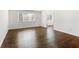 This bedroom has hardwood floors, a window, and an ensuite bathroom at 115 Biscayne Nw Dr # F1, Atlanta, GA 30309